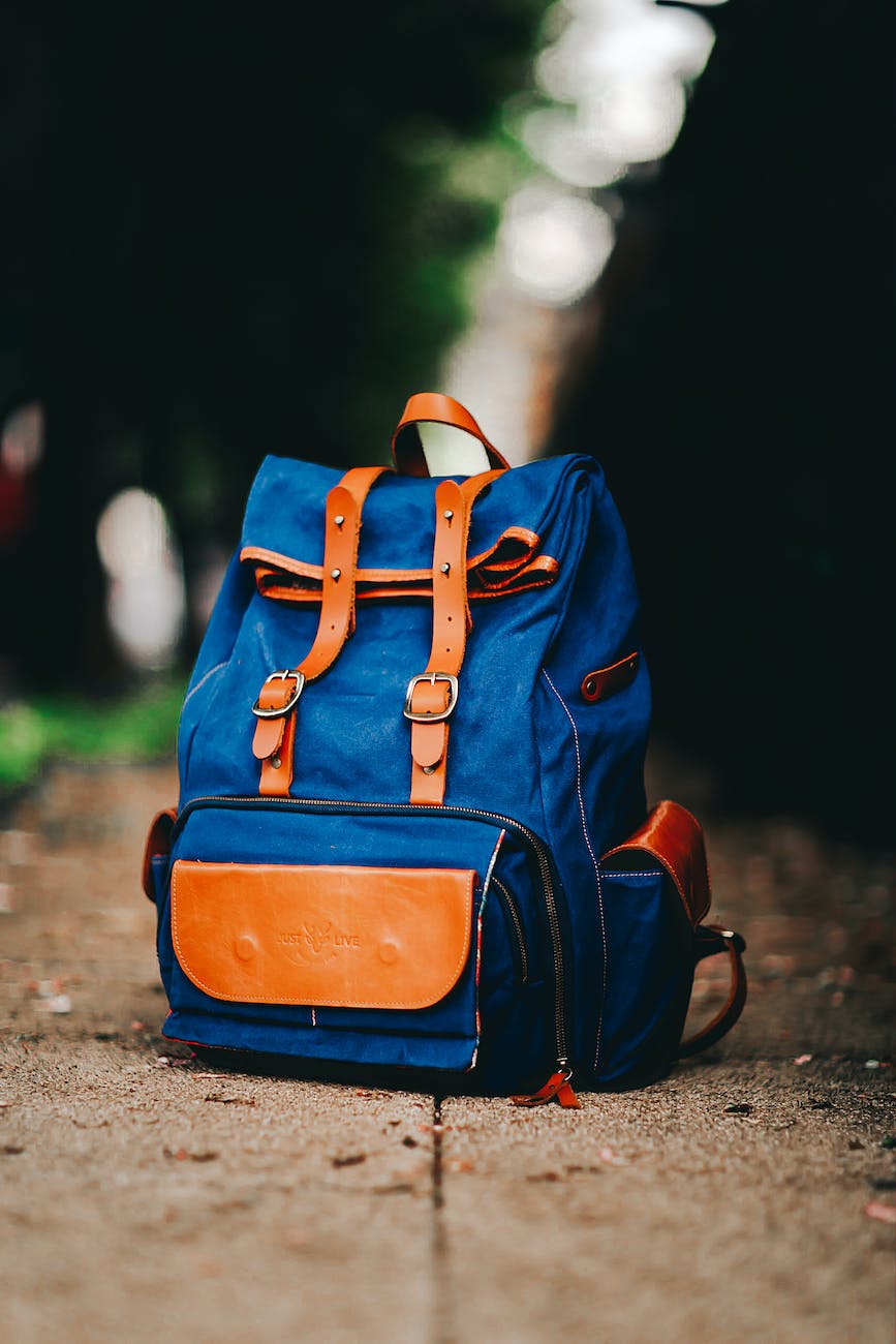 blue and brown backpack on the ground
